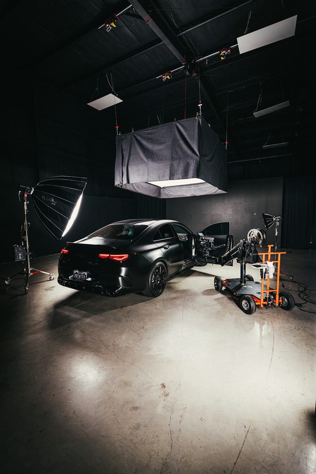 The studio from above with the car under an overhead light